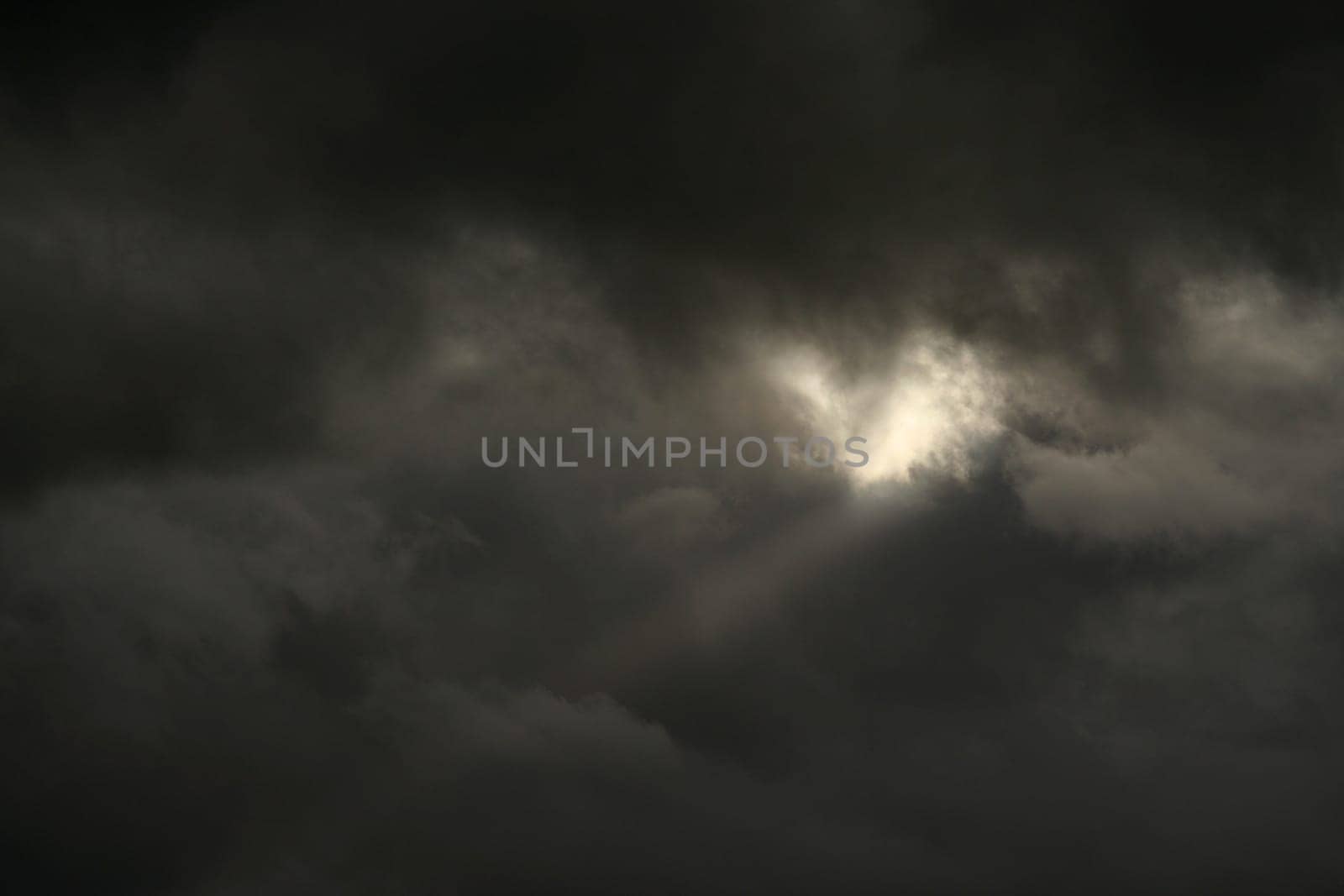 Expectation of something good. Dark clouds and sun beam. Can stand and look couple hours and believe that soon will see sun shining, clear blue skies.
