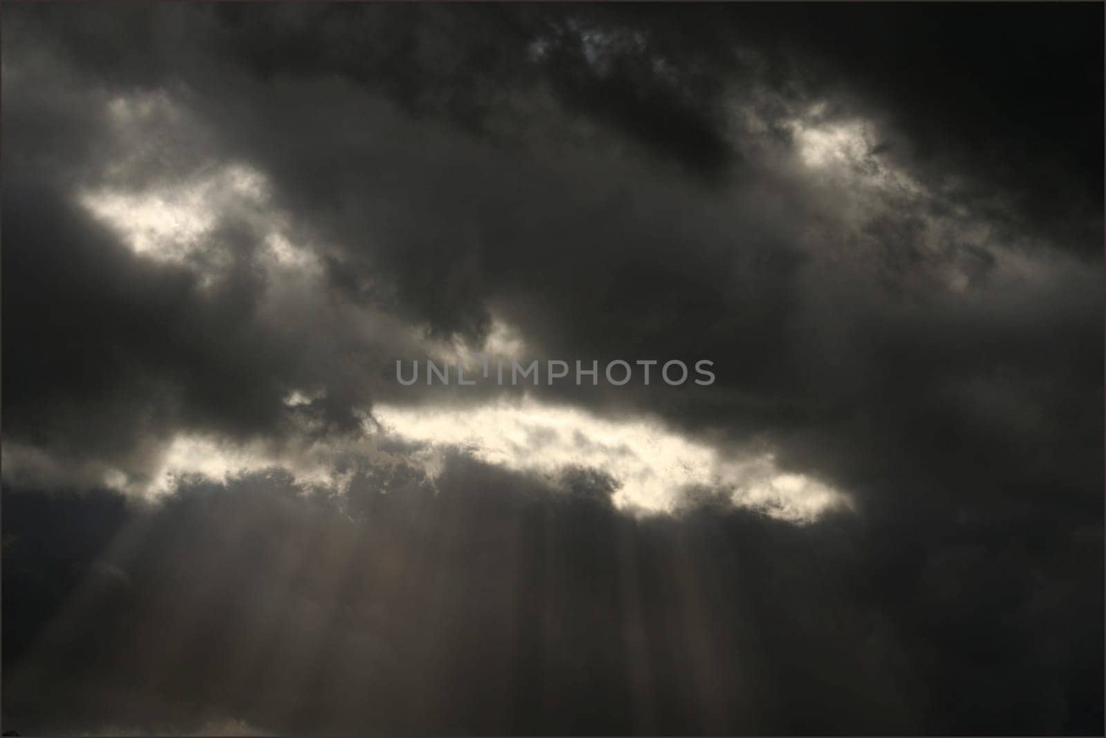 Expectation of something good. Dark clouds and sun beam. Can stand and look couple hours and believe that soon will see sun shining, clear blue skies.