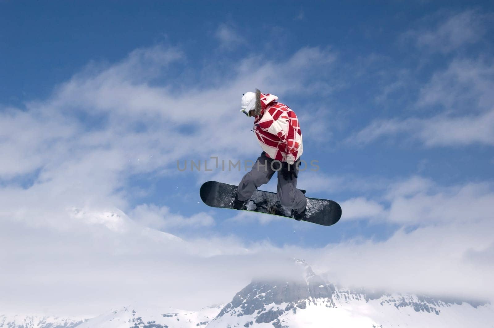 snowboarder jumping high in the air