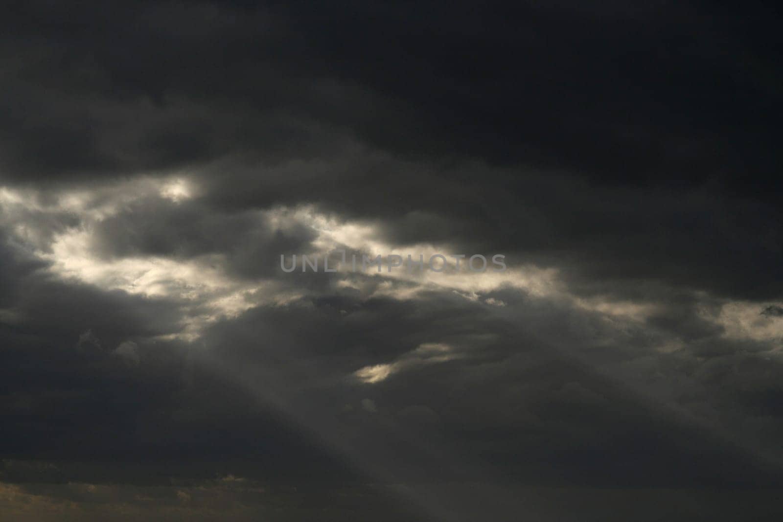 Expectation of something good. Dark clouds and sun beam. Can stand and look couple hours and believe that soon will see sun shining, clear blue skies.