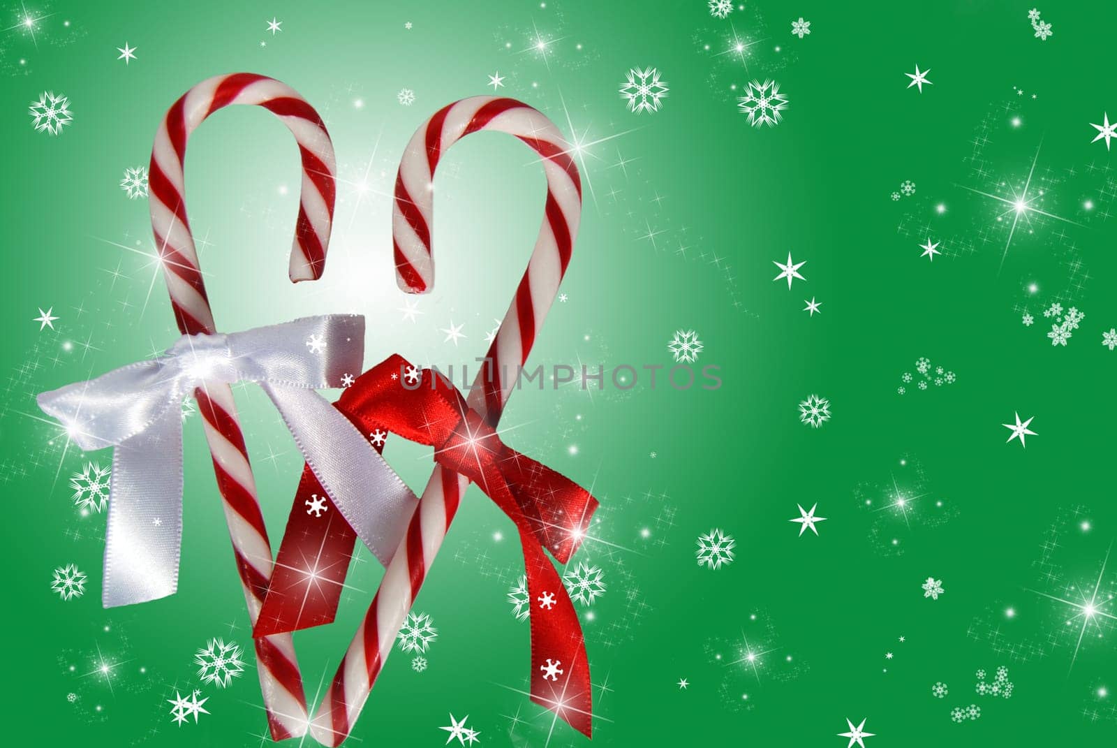Pair of candy canes formed into a heart on a festive background.