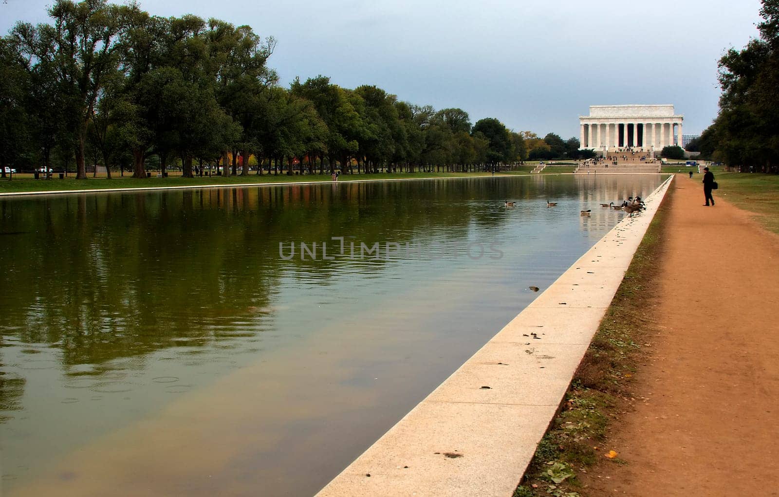 Converging lines of the reflecting pool leading to the Lincoln Memorial in Washington DC