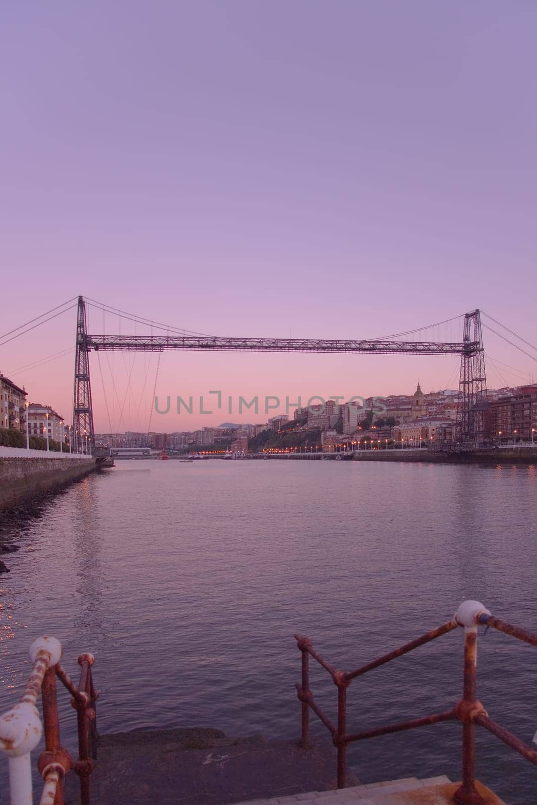 Suspension bridge of Bizkaia growing dark from getxo