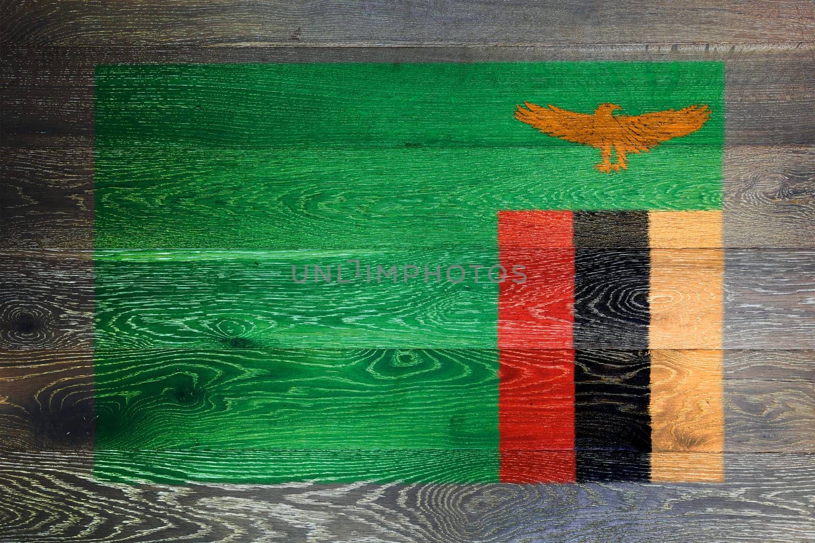 A Zambia flag on rustic old wood surface background