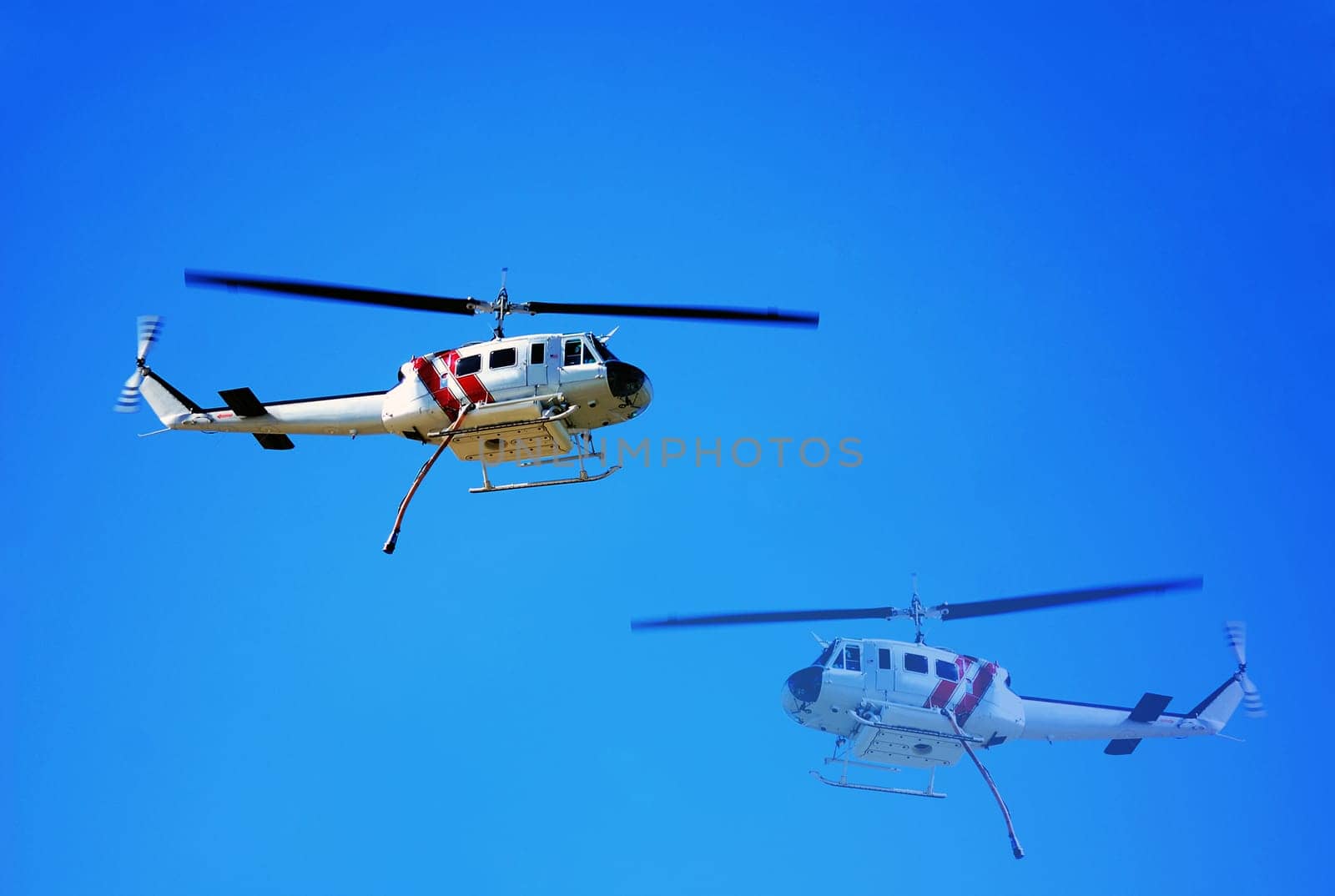 Helicopter making water drops for the firemen on the ground battling California wildfires in Los Angeles.