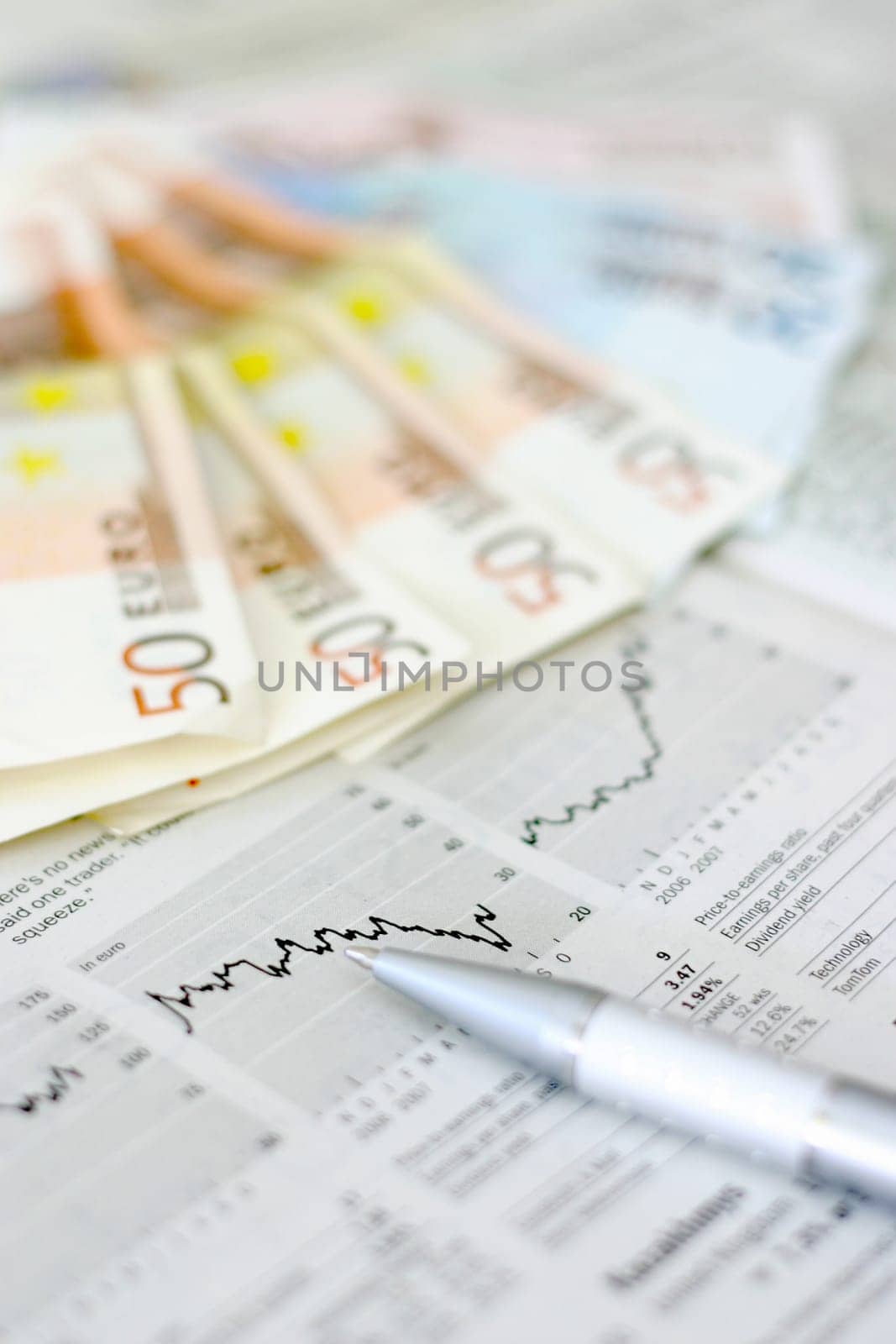 Money and a business newspaper
