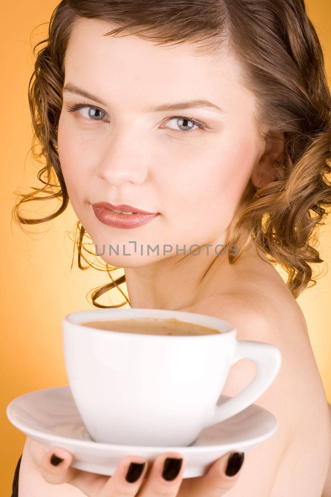 glamorous girl having a cup of coffee