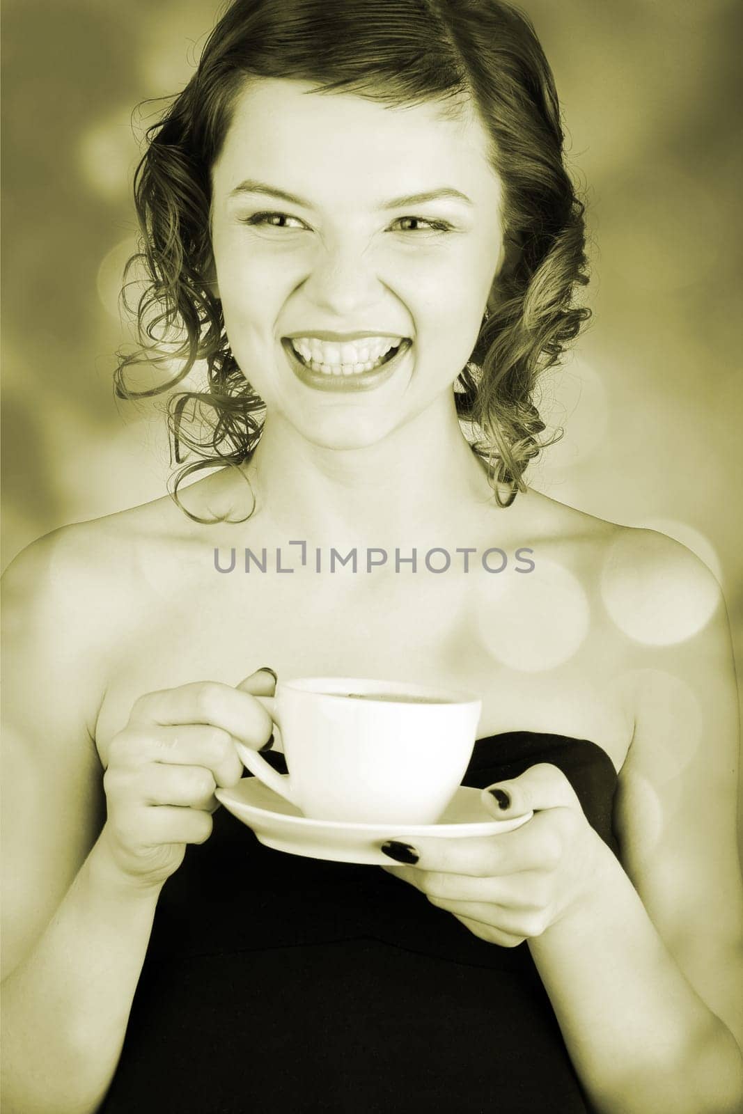 glamorous girl having a cup of coffee