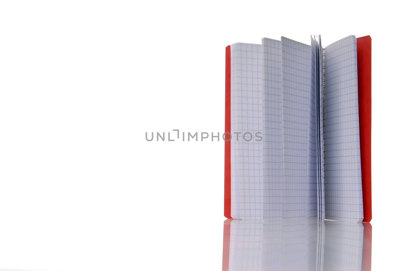 red notebook isolated over white. With reflection