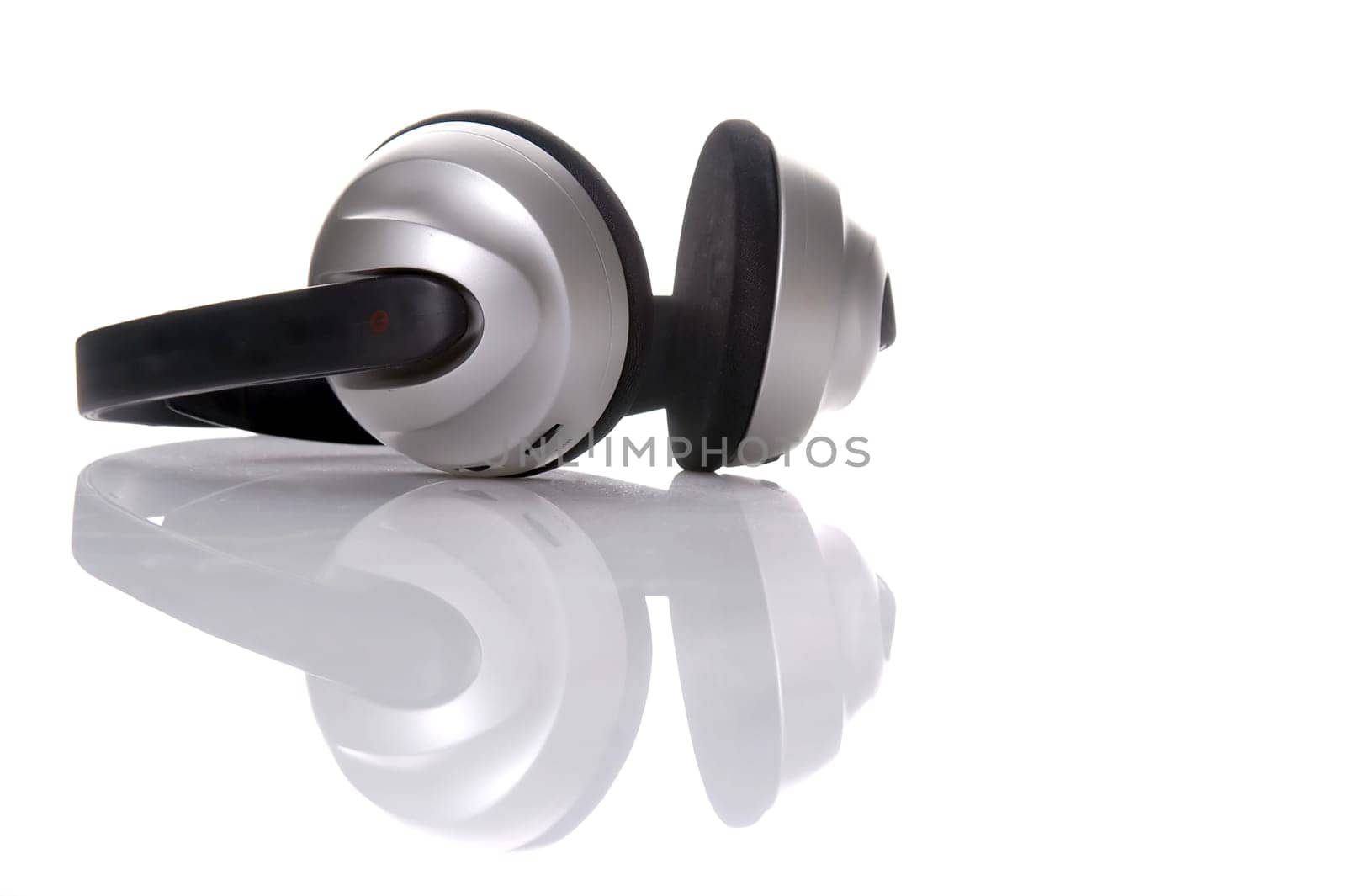 black and gray headphone isolated over white, with reflection