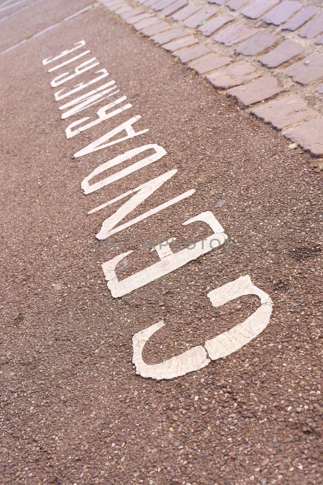 Writing Gendarmerie on a parking lot in front of a police station in Colmar in France. Translation of the text: Police