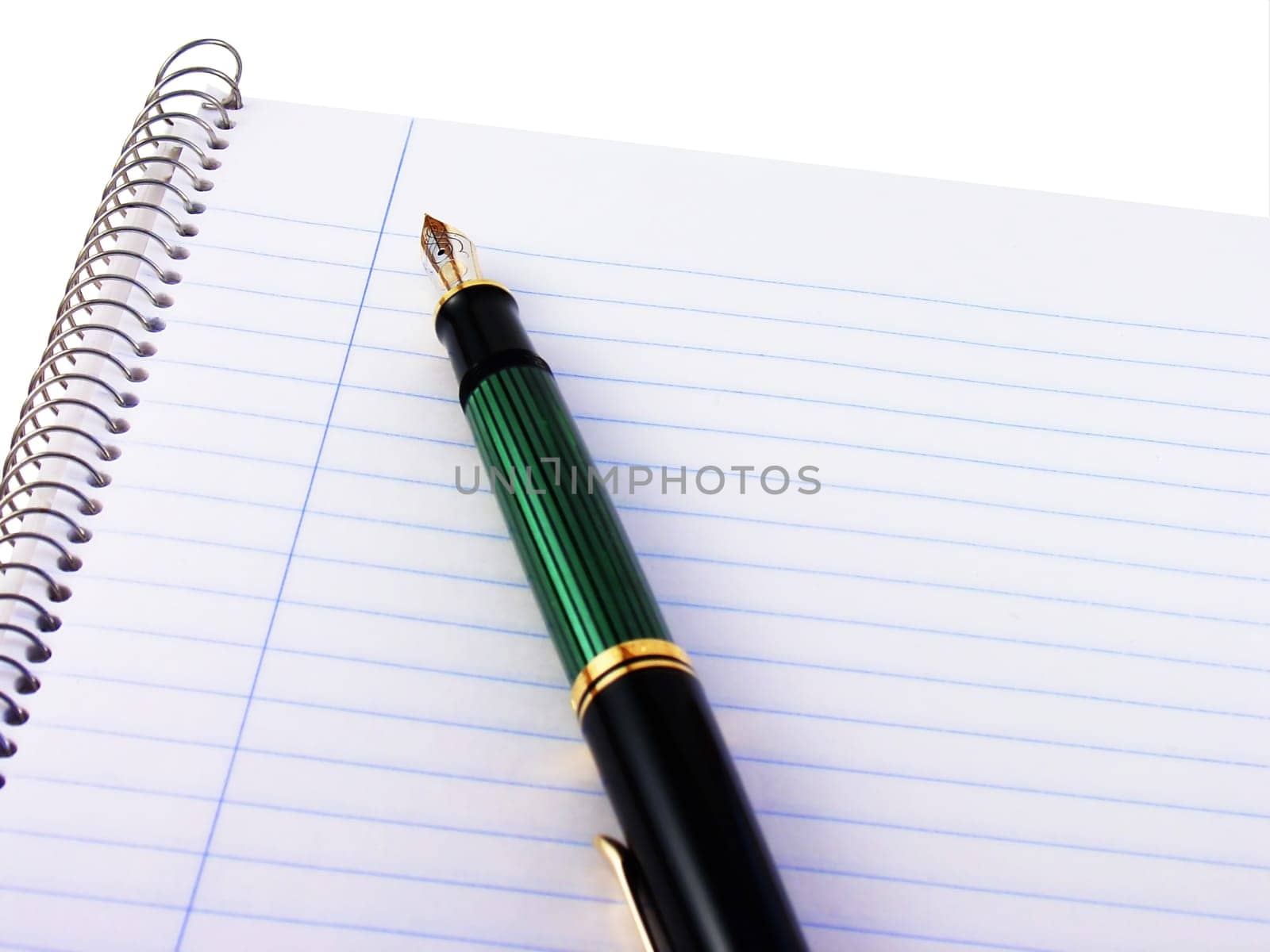 Spiral notebook with a fountain pen