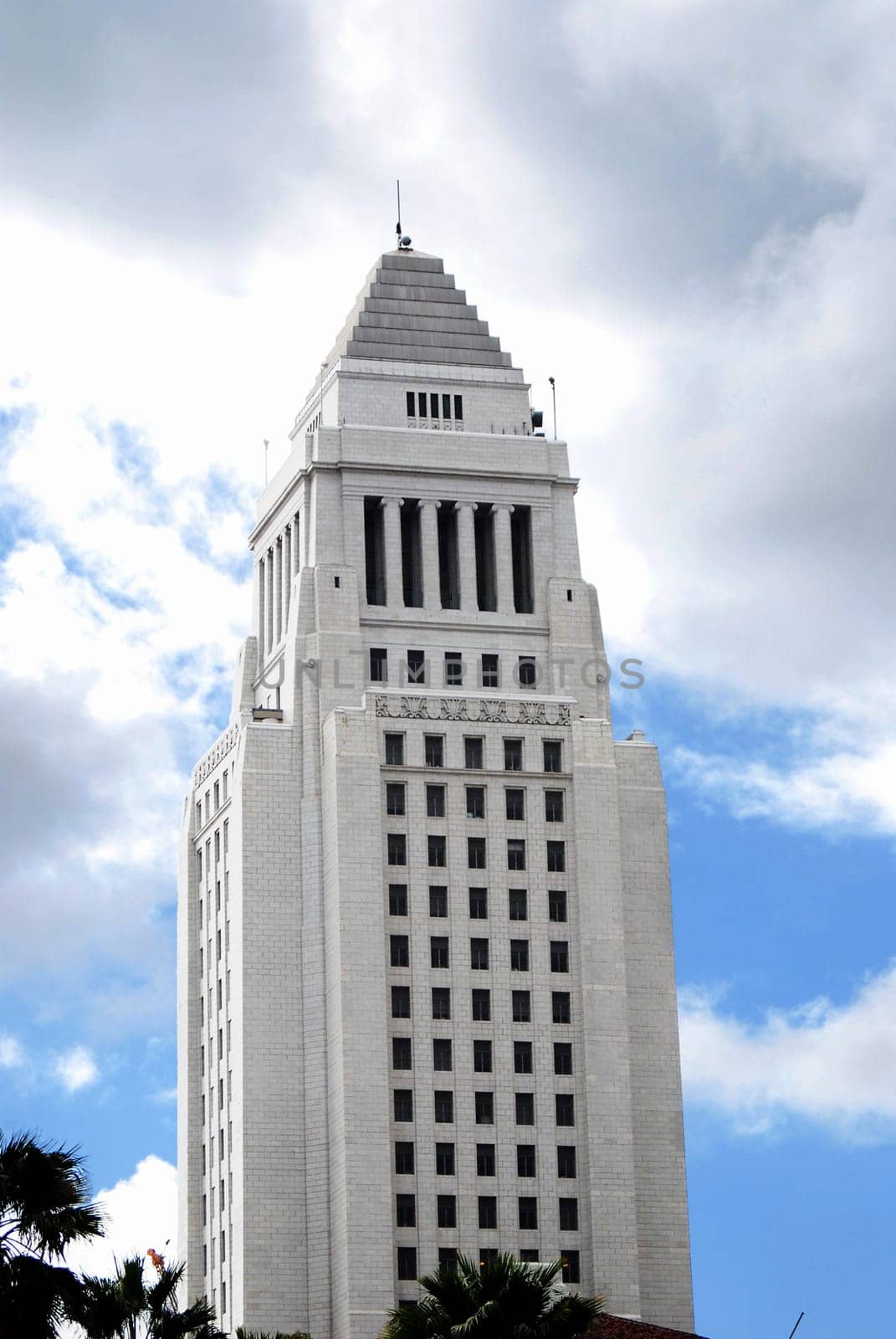 Skies are clearing up as sun shines down on city hall in Los Angeles, California.