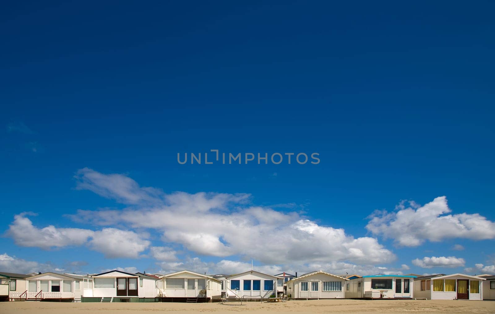 Beachs huts in a row by IJmuiden, the Netherlands