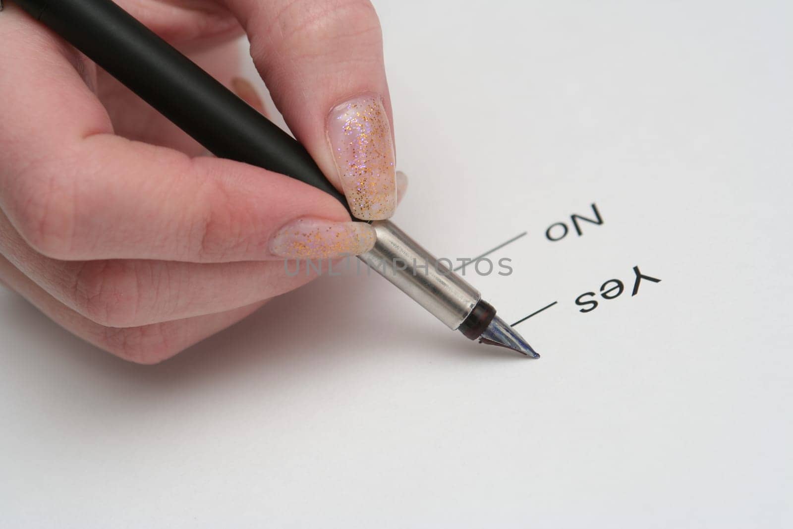 The girl writes the handle in a notebook