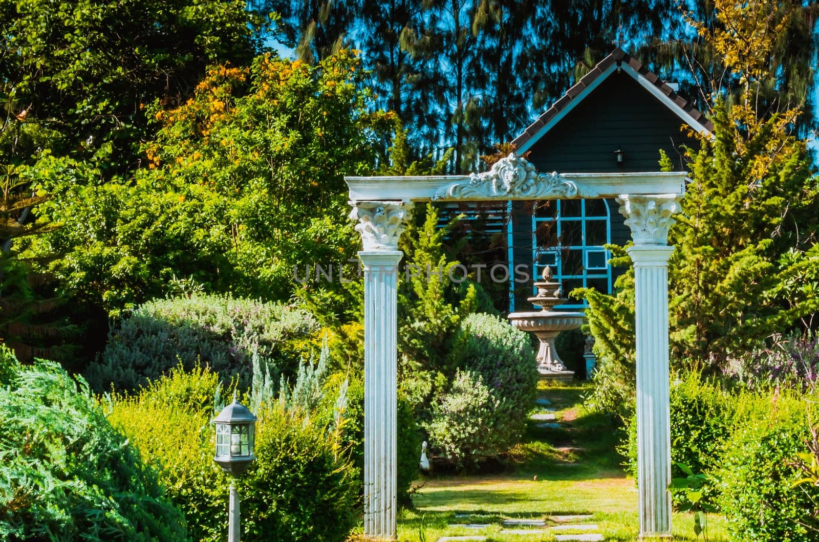 Stunning Entrance Portico Gate classic style decoration of a Public Garden. Column Stone structure element in classic architecture detail