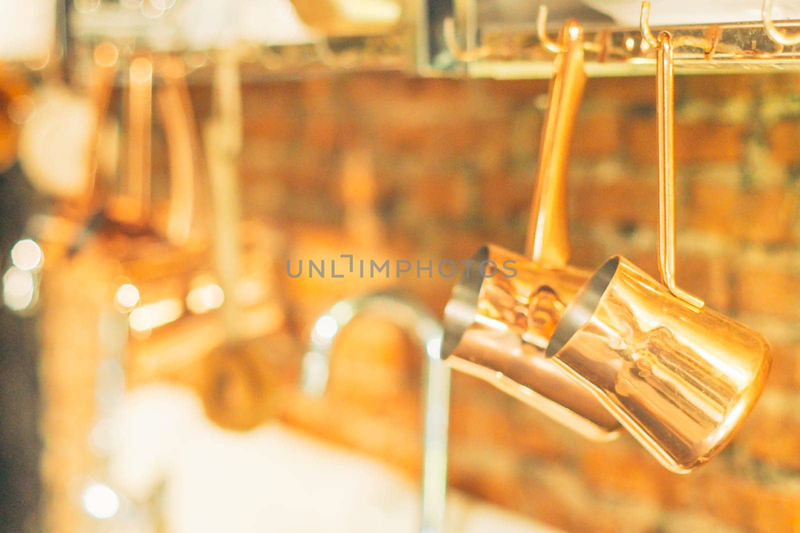 Vintage kitchen utensils on the wall above the sink. retro kitchenware retro kitchen