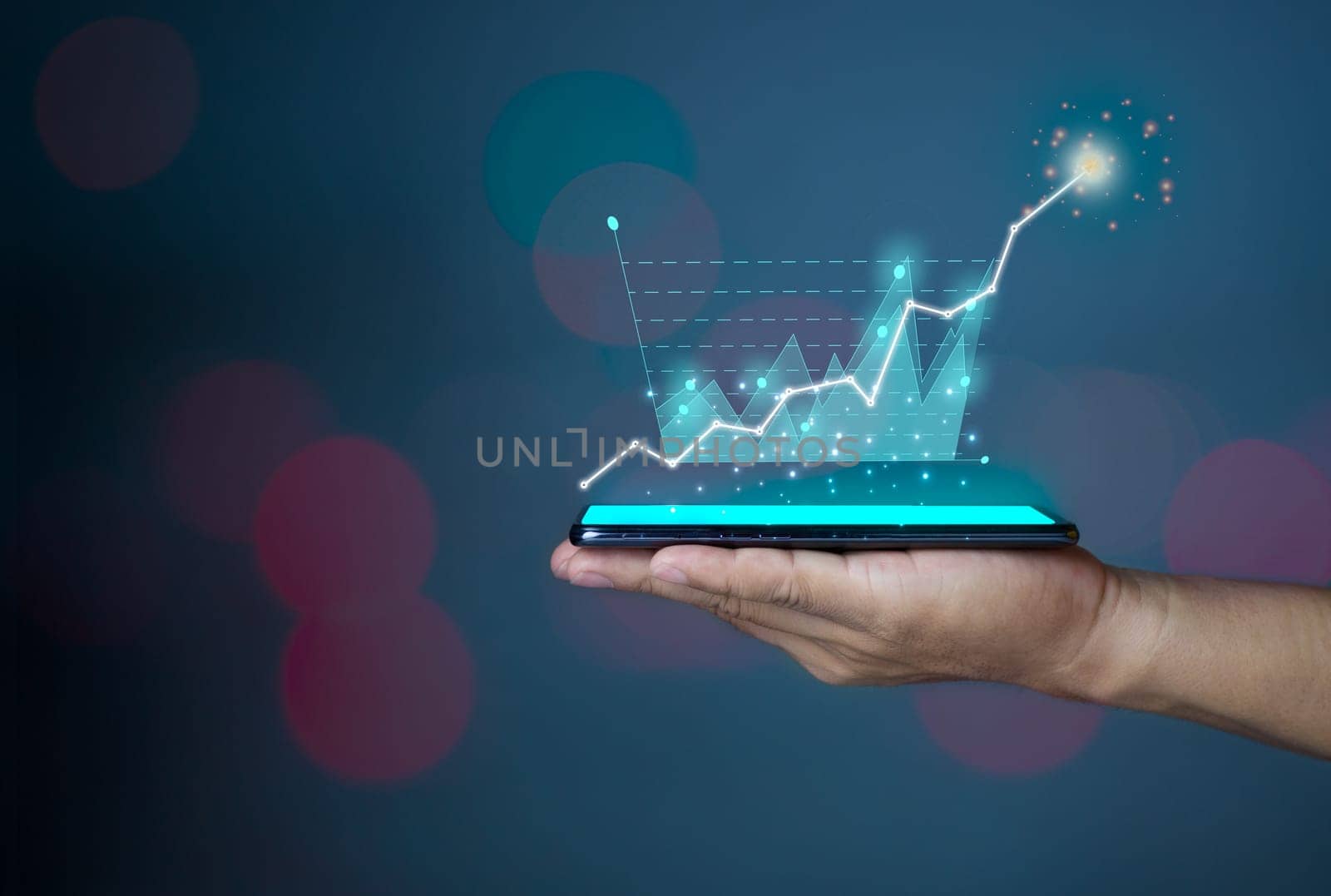 Hologram image of a  chart from a phone on a person's hand. Offer trading, investment ideas