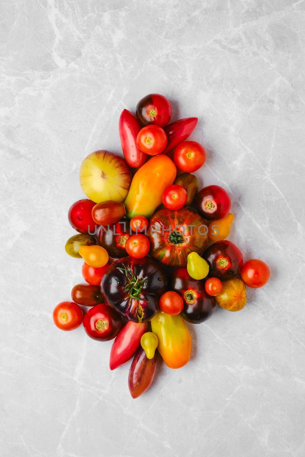 Assortment of fresh colourful tomatoes, top view