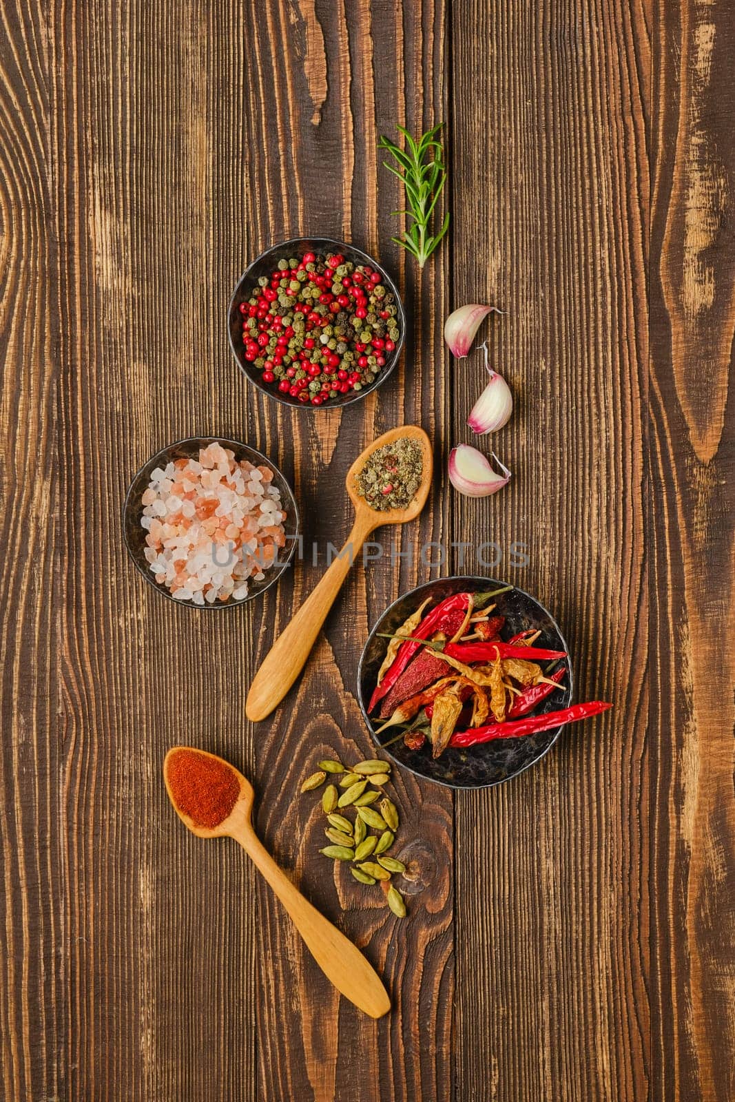 Overhead composition with spicy spice and seasonings on wooden background