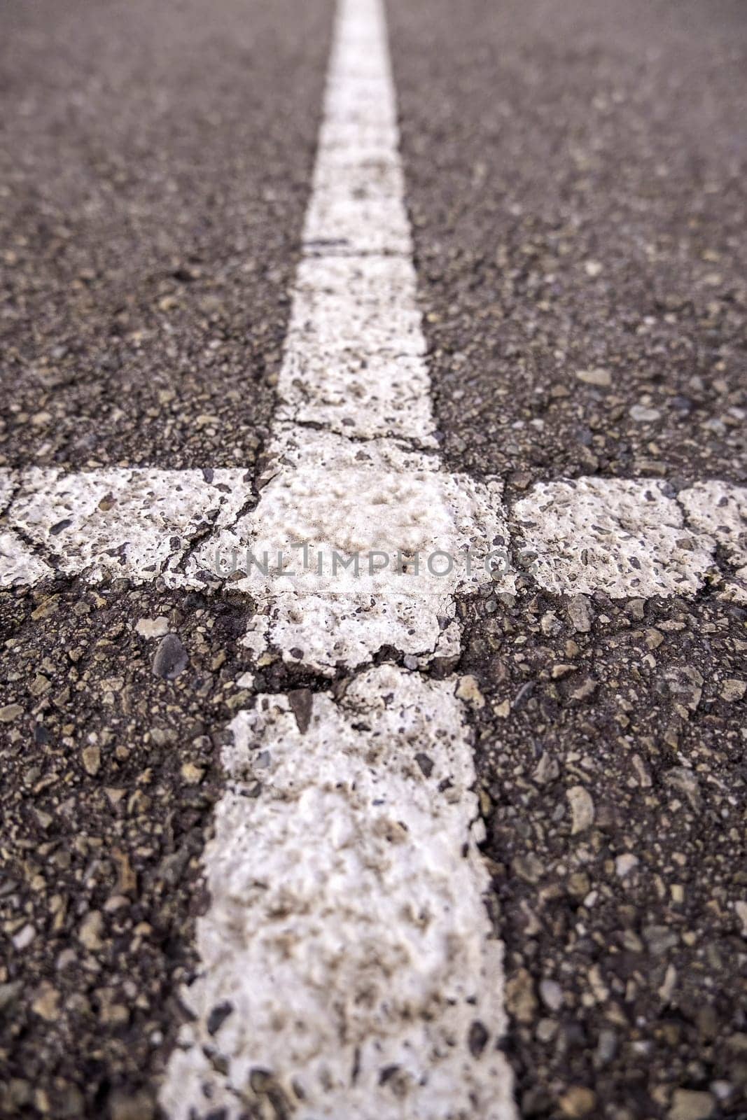 Marking lines on the asphalt, information sign