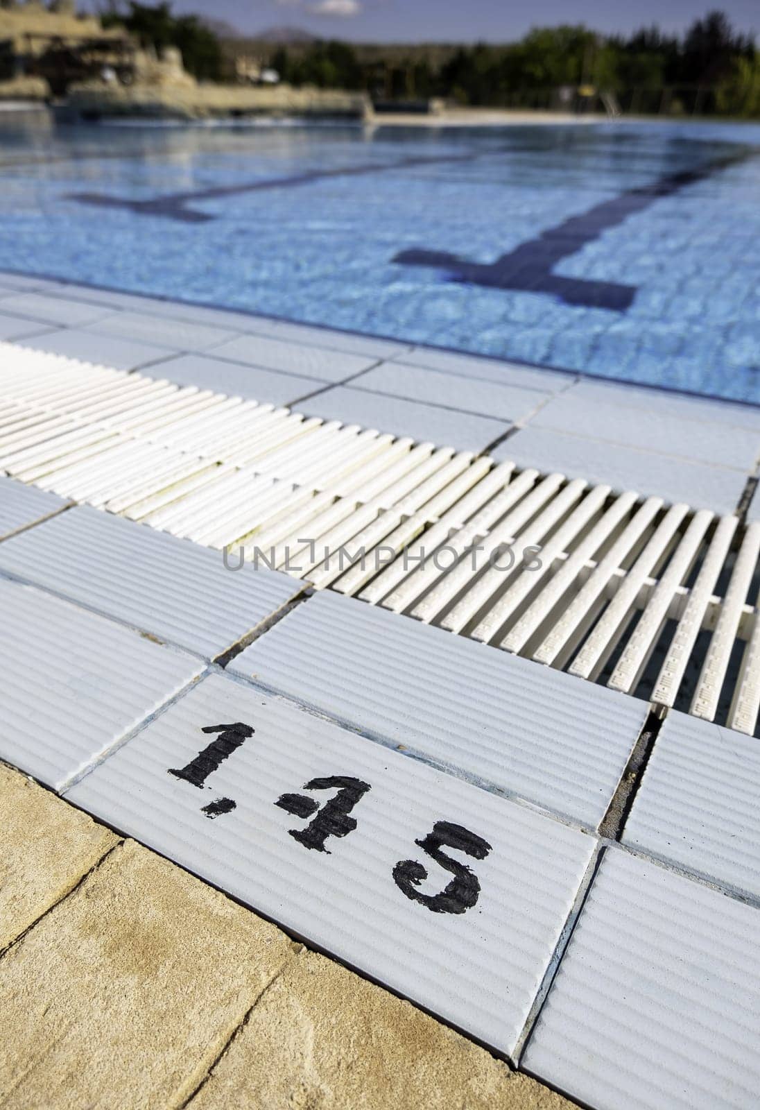 Detail of depth number in an outdoor swimming pool