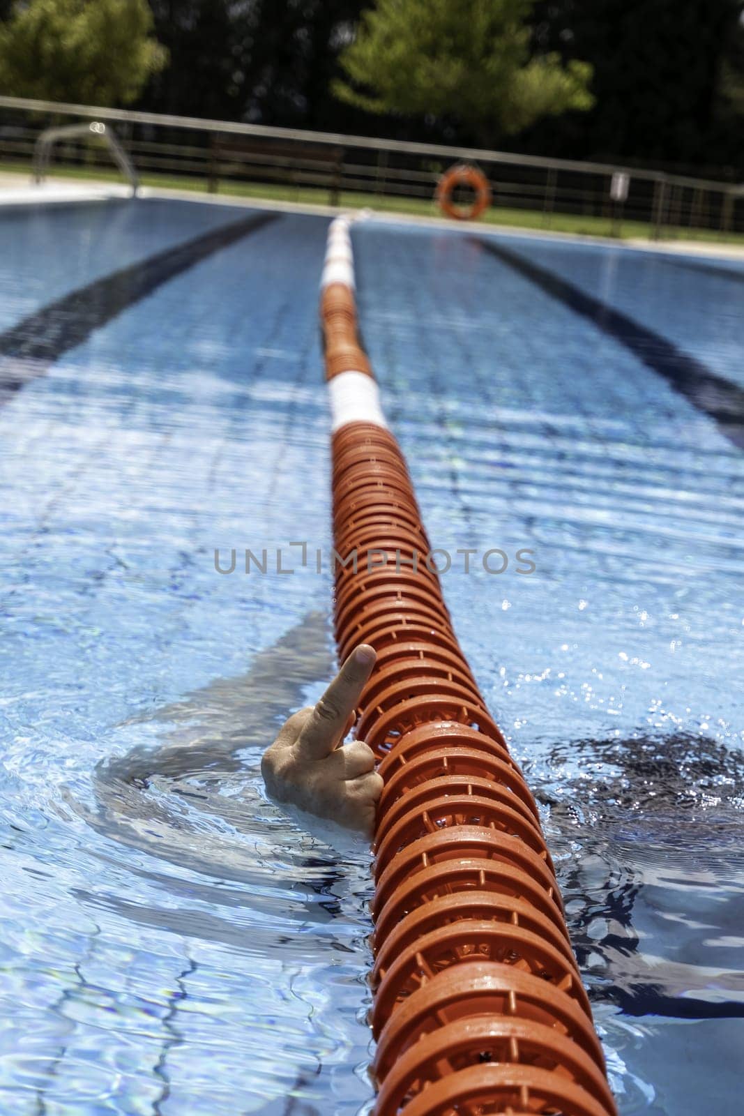 Detail of young woman doing sports in the water