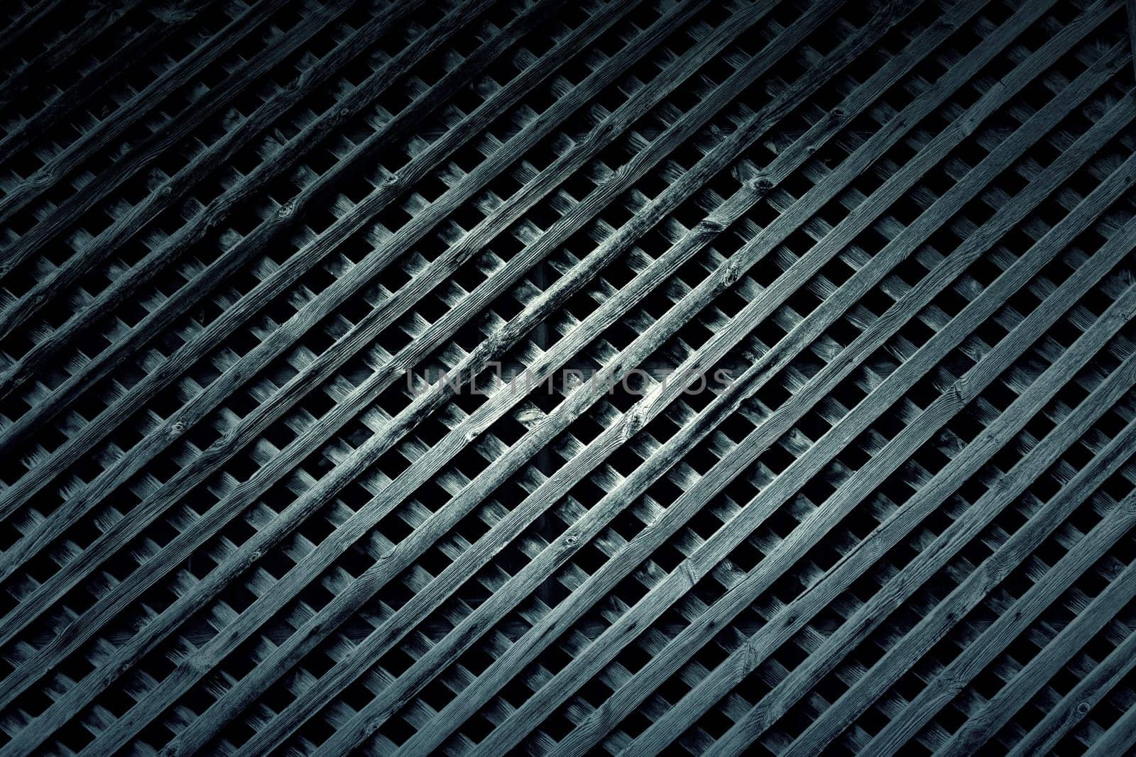 Detail of wooden grille for protection and decoration in a window