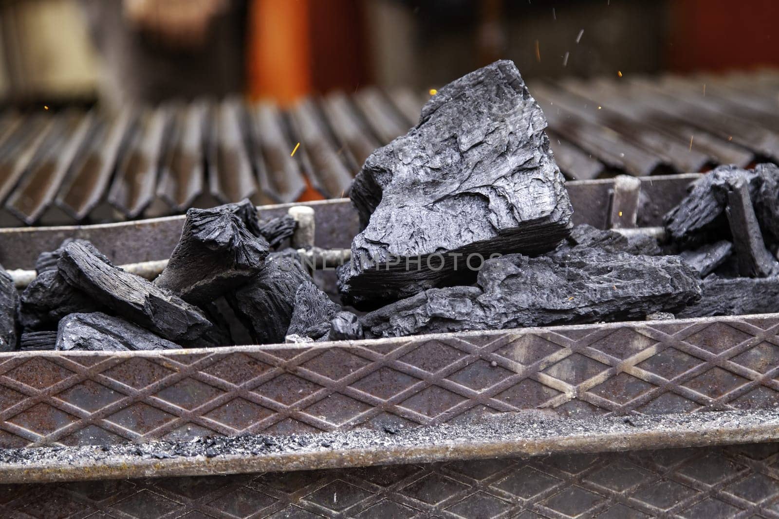 Detail of burning charcoal in a barbecue for cooking