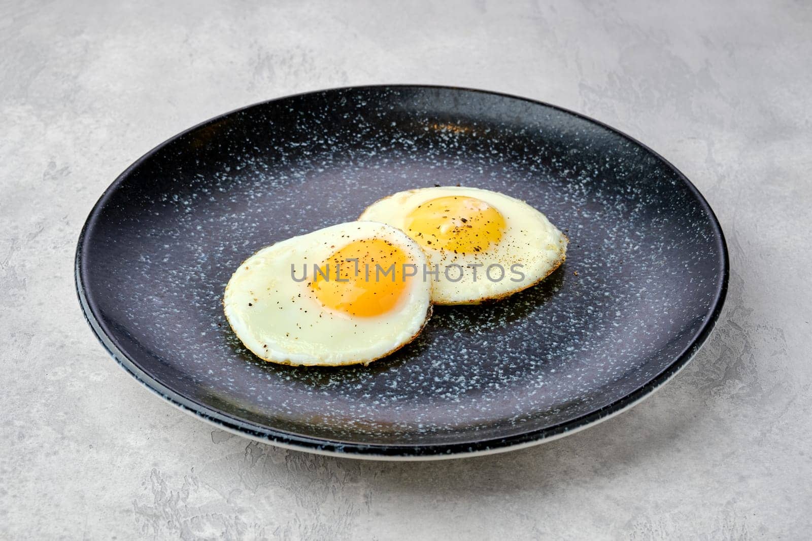 Two fried eggs on a plate