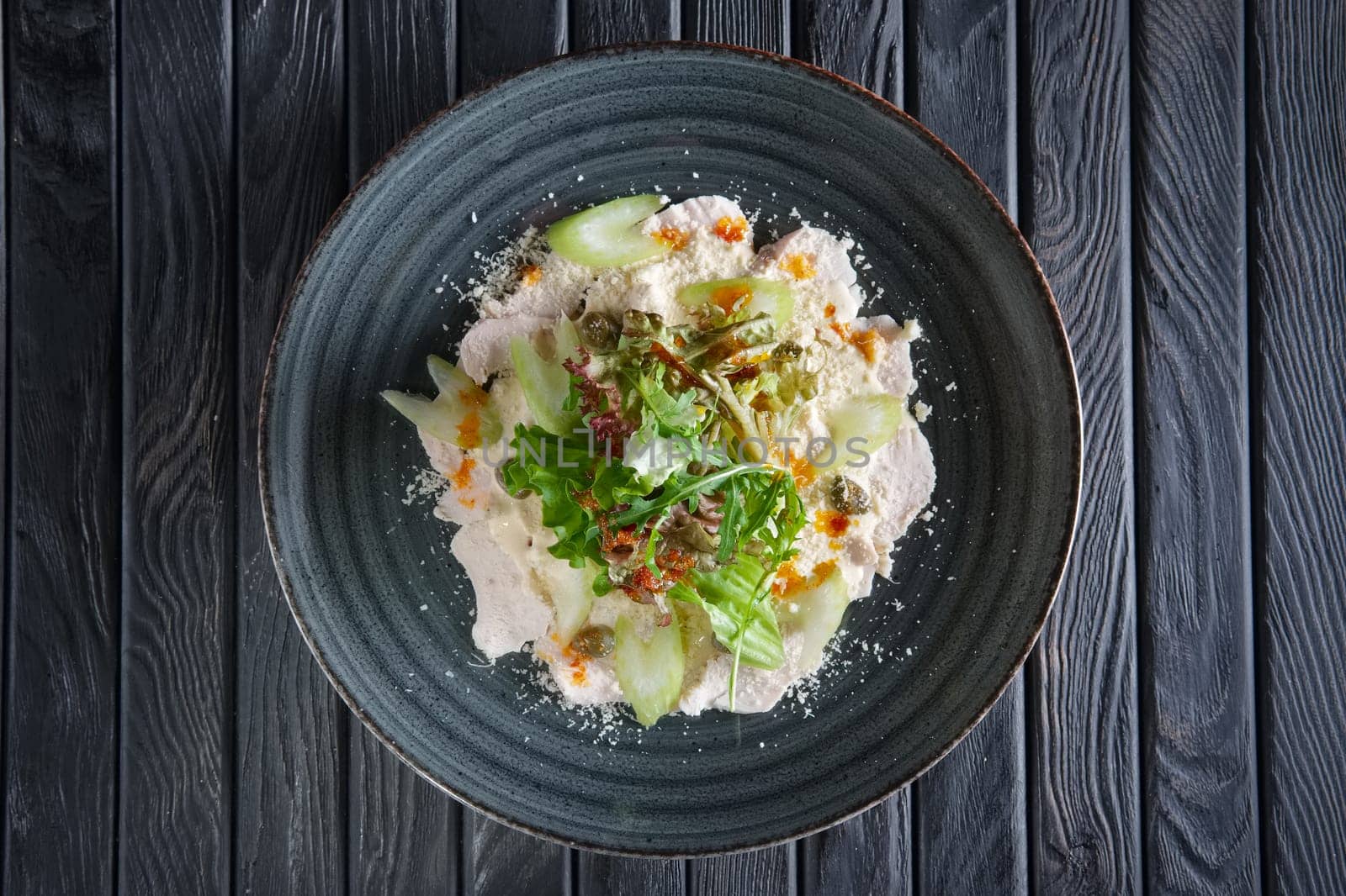 Boiled chicken fillet with vegetables and salad dripped with vinegar sauce