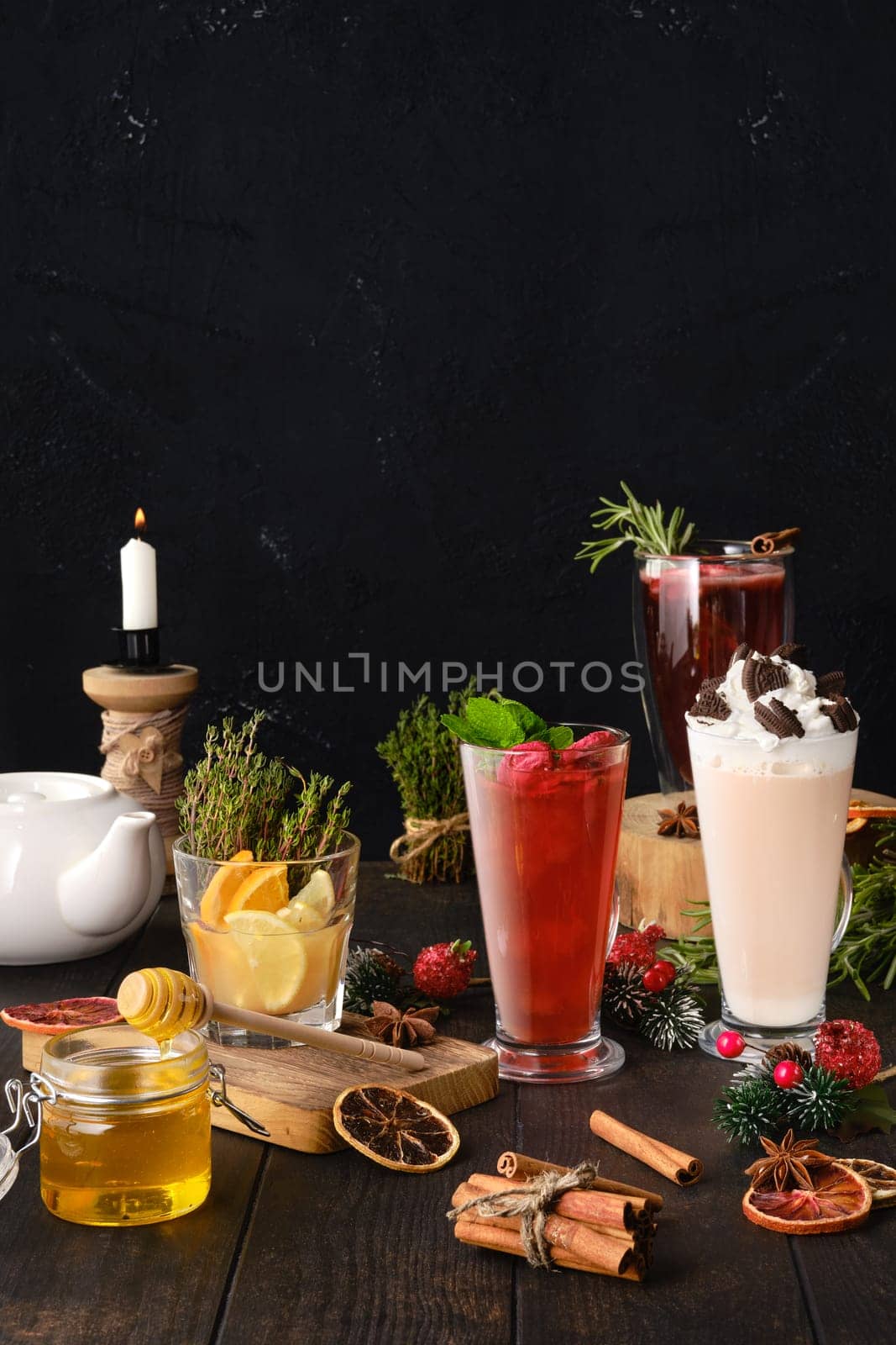 Composition with herbal and fruit tea with ingredients on the table