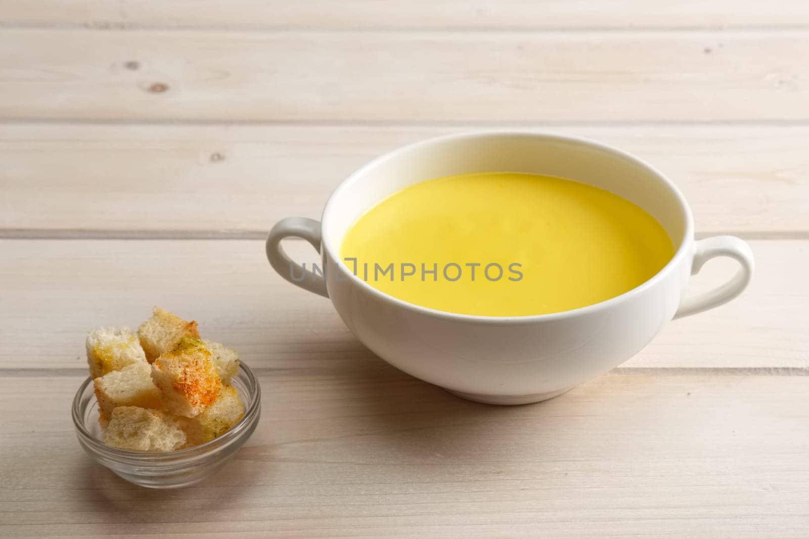 Chicken soup puree with white bread chips
