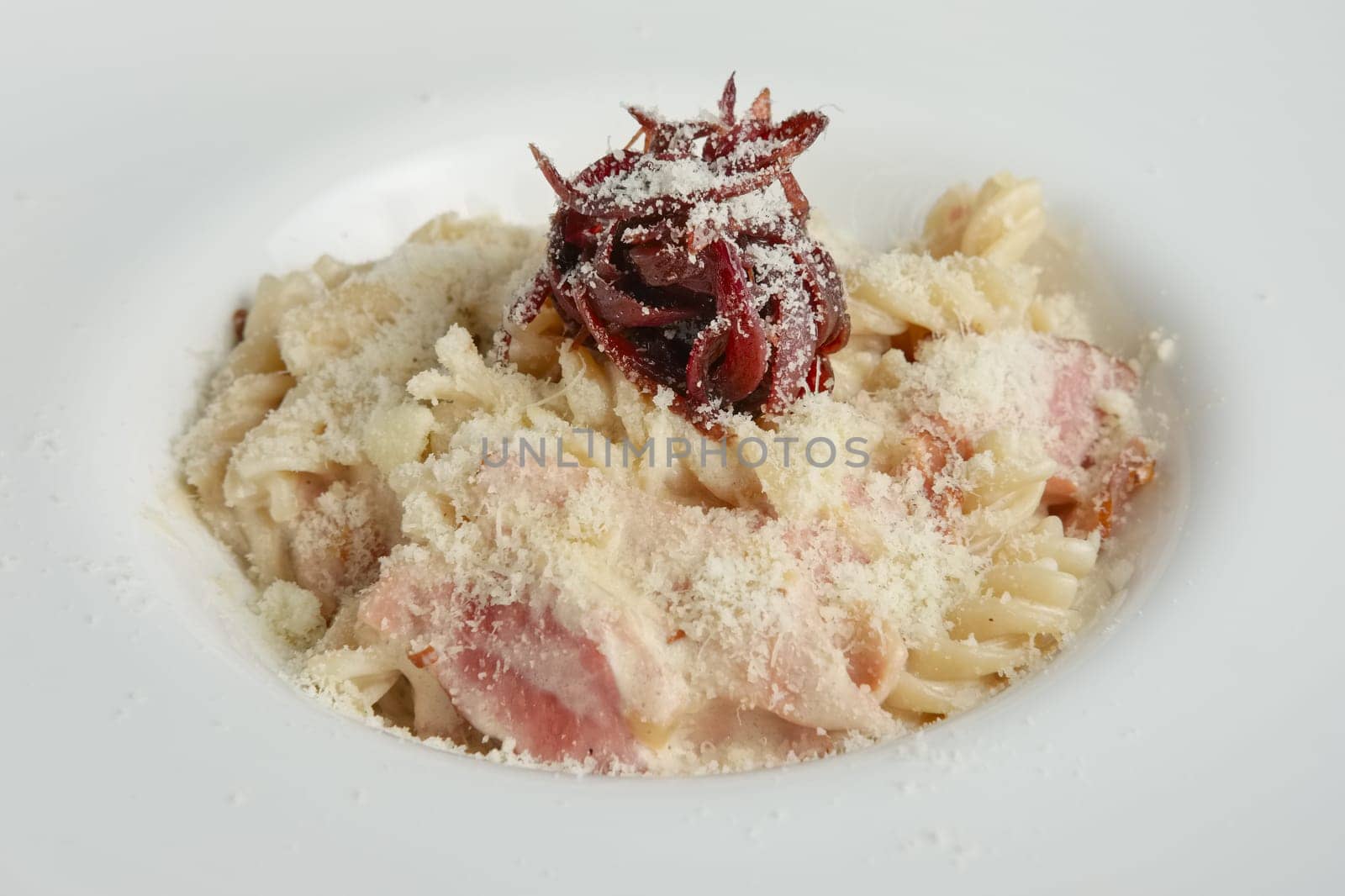 Close up of pasta with salmon and onion marmalade
