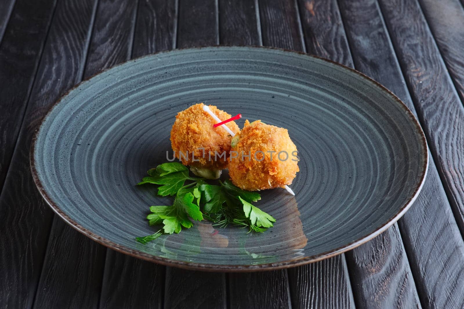 Appetizer for reception. Fried mozzarella balls rolled in bacon in breading