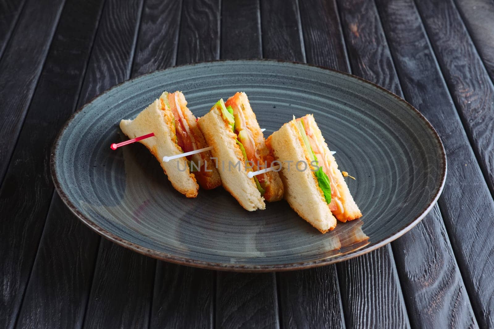 Appetizer for reception. Three mini club sandwich on plate