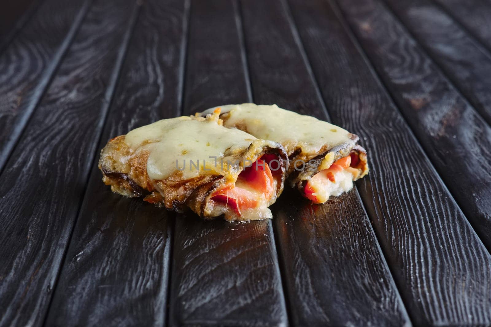 Appetizer for reception. Eggplant stuffed with bacon, ham, onion topped with melted cheese