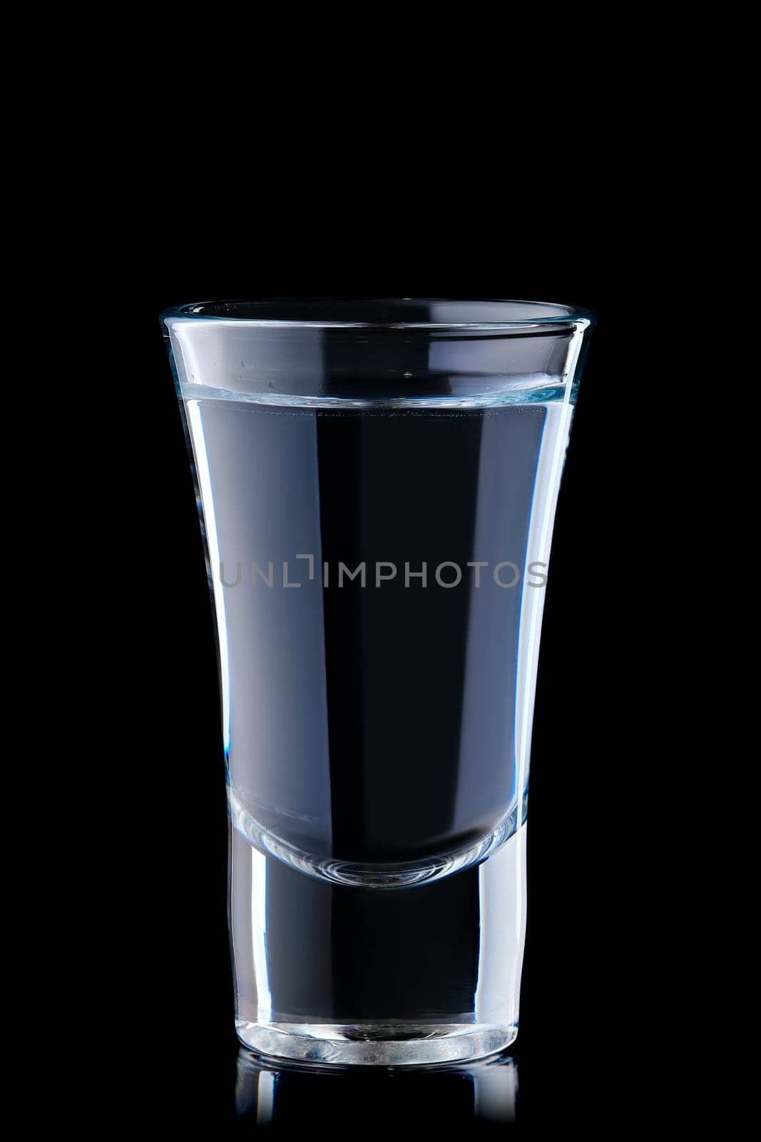 Shot with vodka isolated on black background