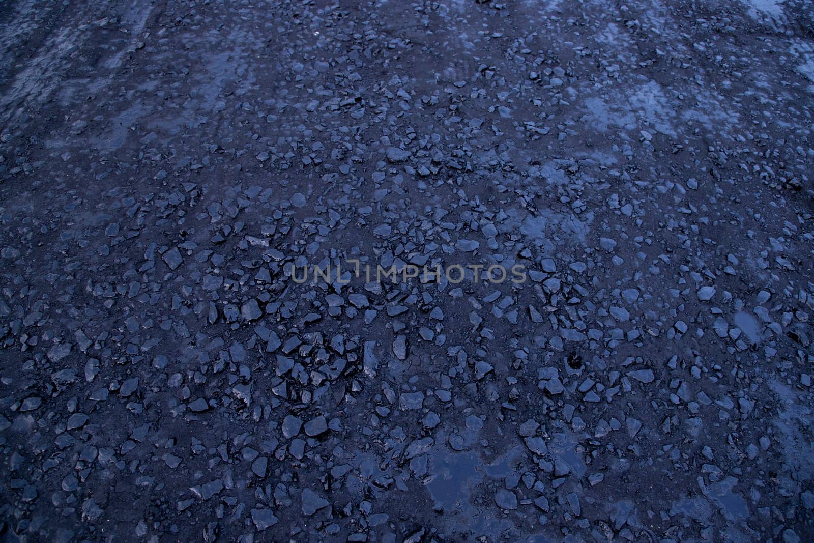 Black Raw  bitumen mosaic road stone  Texture background