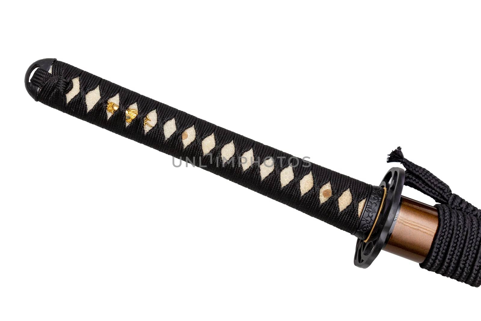 Tsuka - handle of Japanese sword wrapped by black silk cord on white ray skin isolated in white background. Selective focus.