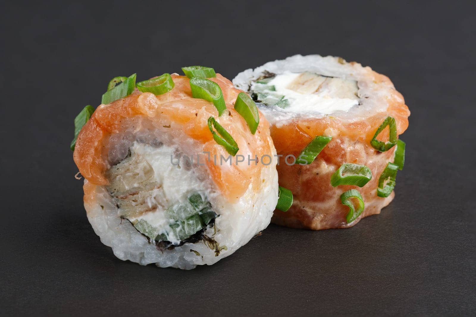 Salmon rolls with eel, green onion and cucumber