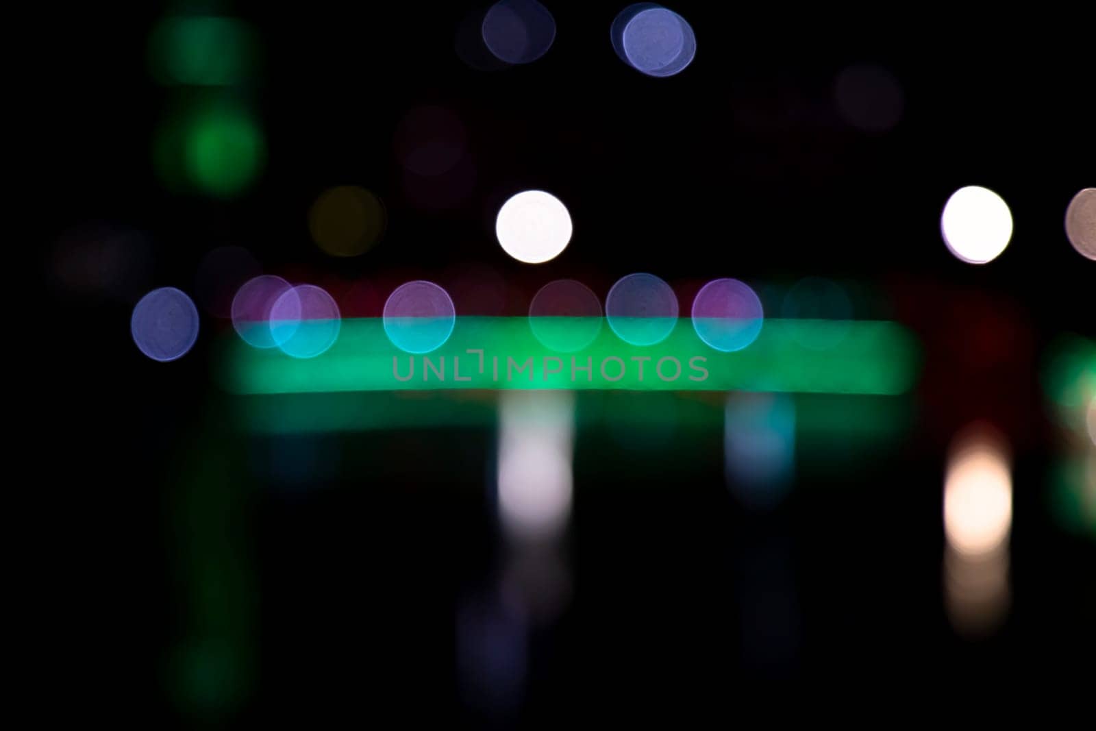 Abstract colorful bokeh light effects on the night black background texture