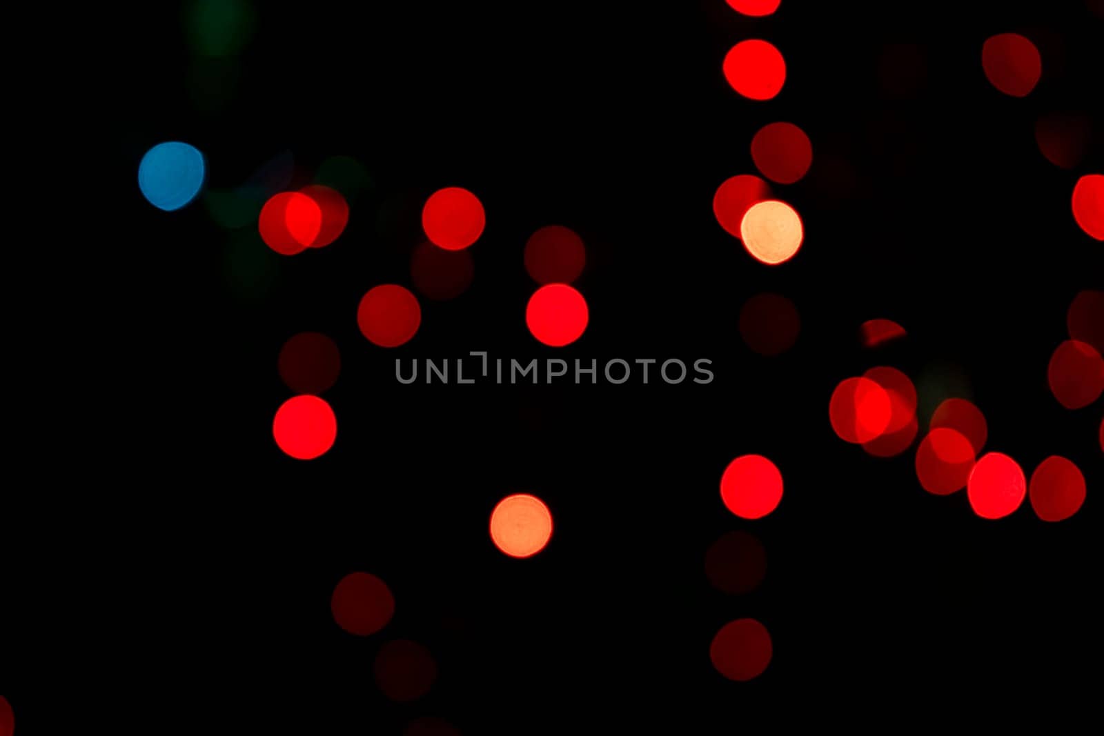 Red Abstract bokeh light effects on the night black background texture