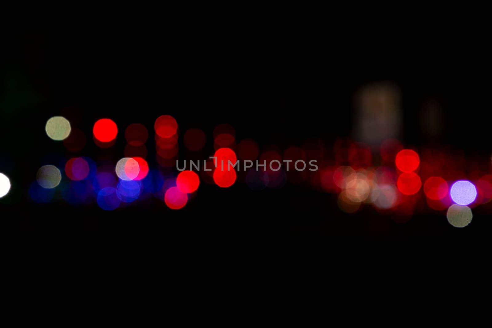 Abstract colorful bokeh light effects on the night black background texture