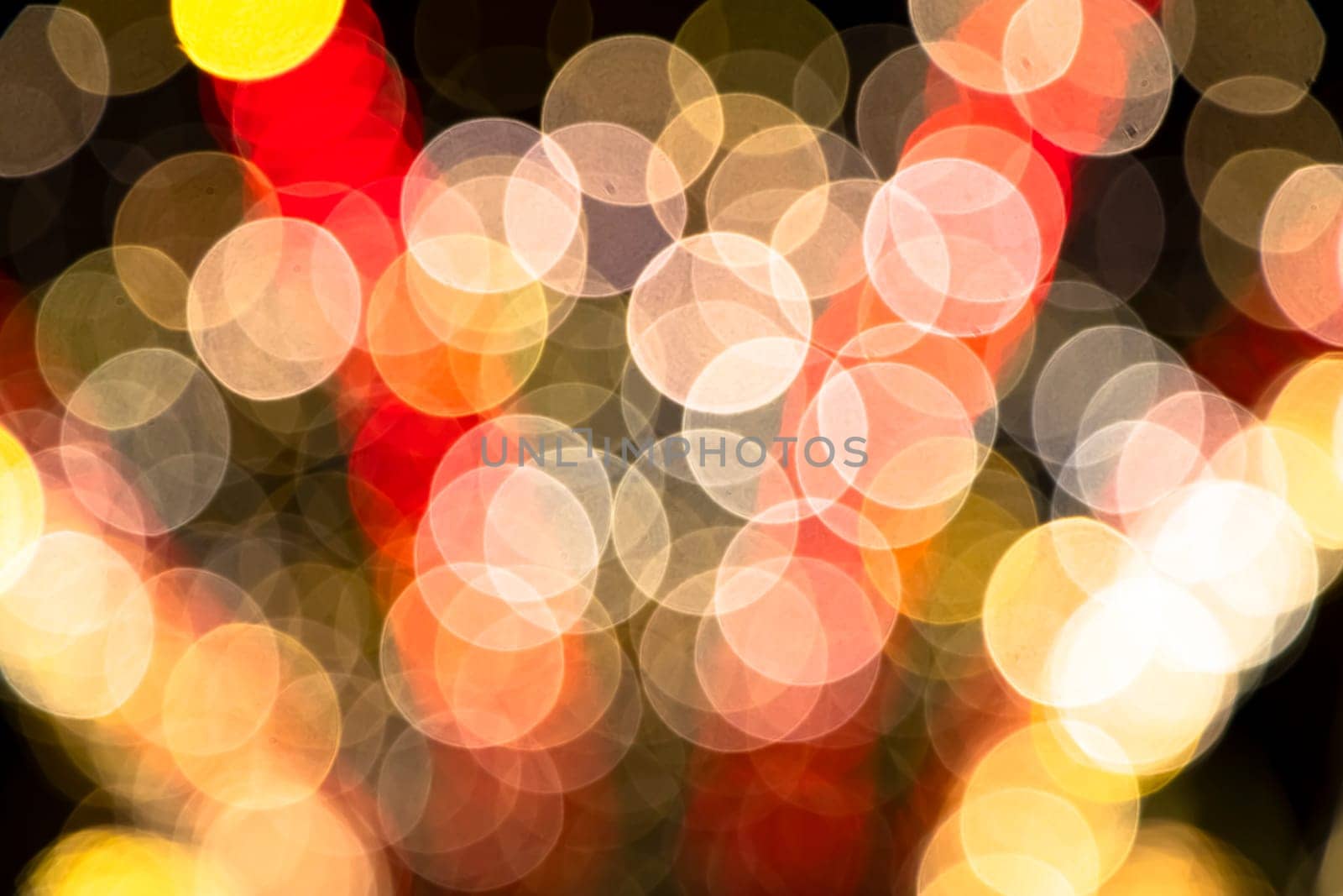 Abstract colorful bokeh light effects on the night black background texture