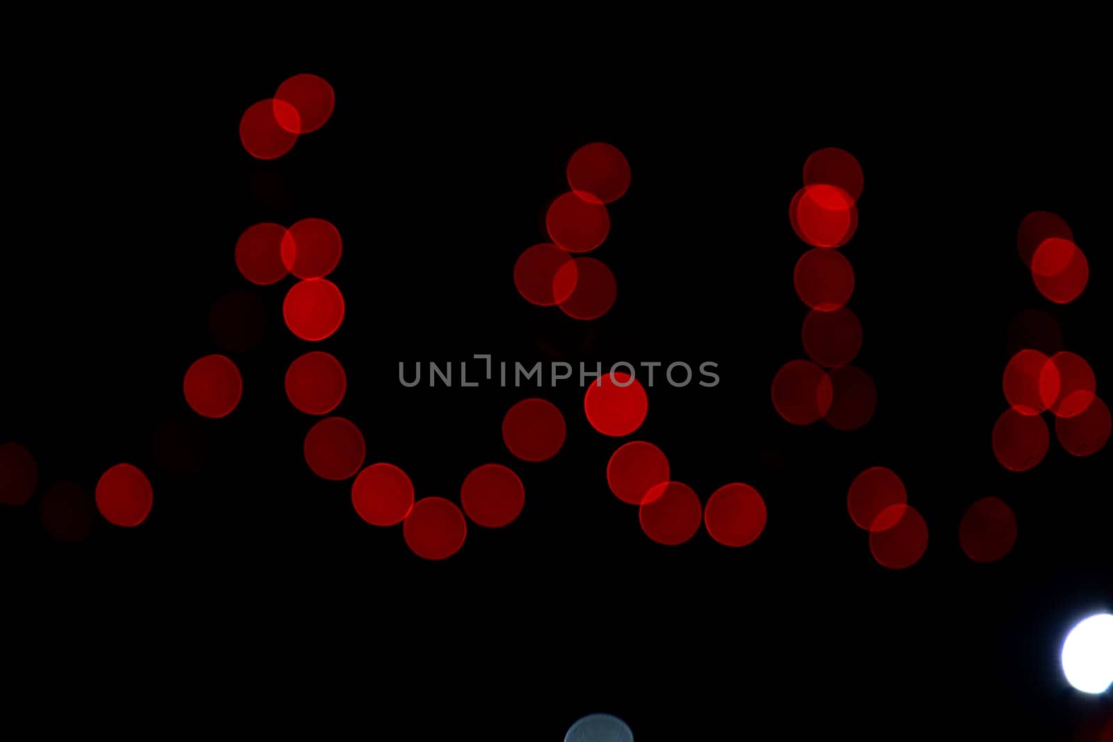 Red Abstract bokeh light effects on the night black background texture