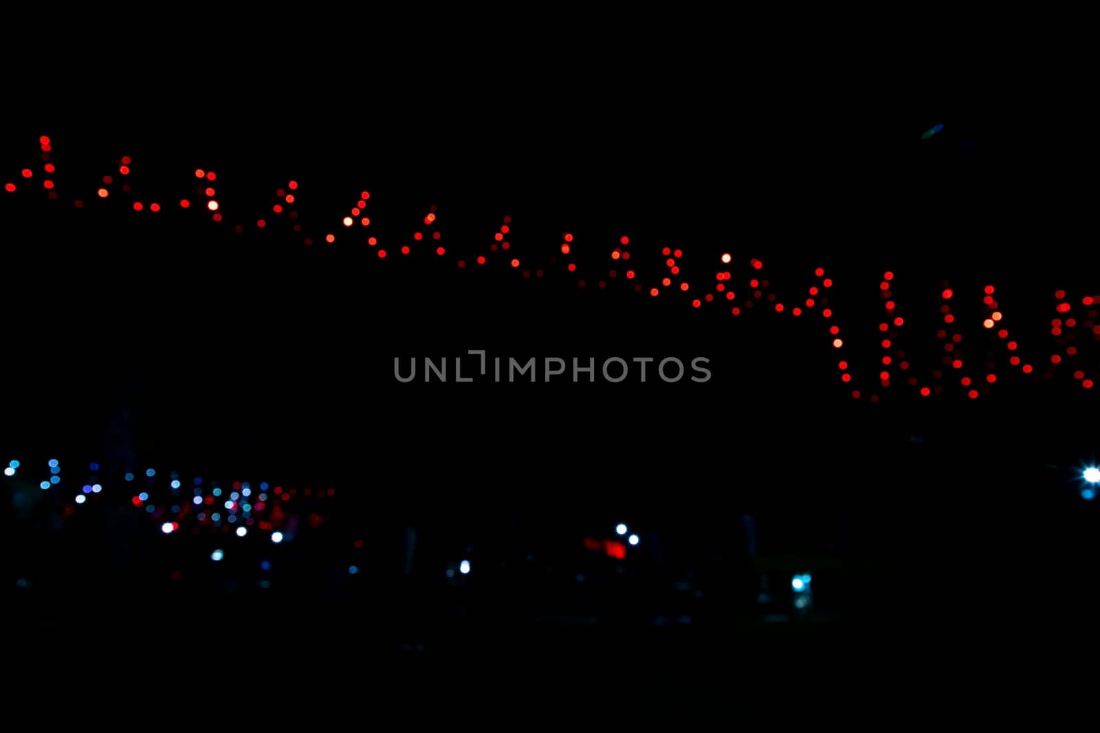 Abstract colorful bokeh light effects on the night black background texture