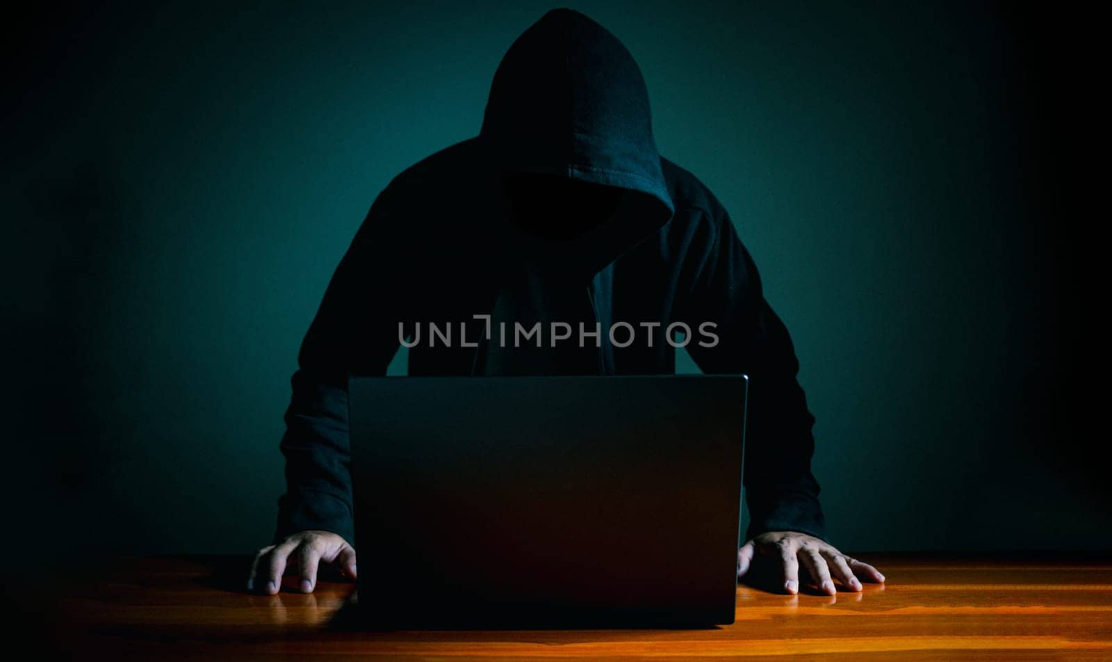 Hackers work on laptops in the dark. The concept of information security in the Internet network and information espionage.