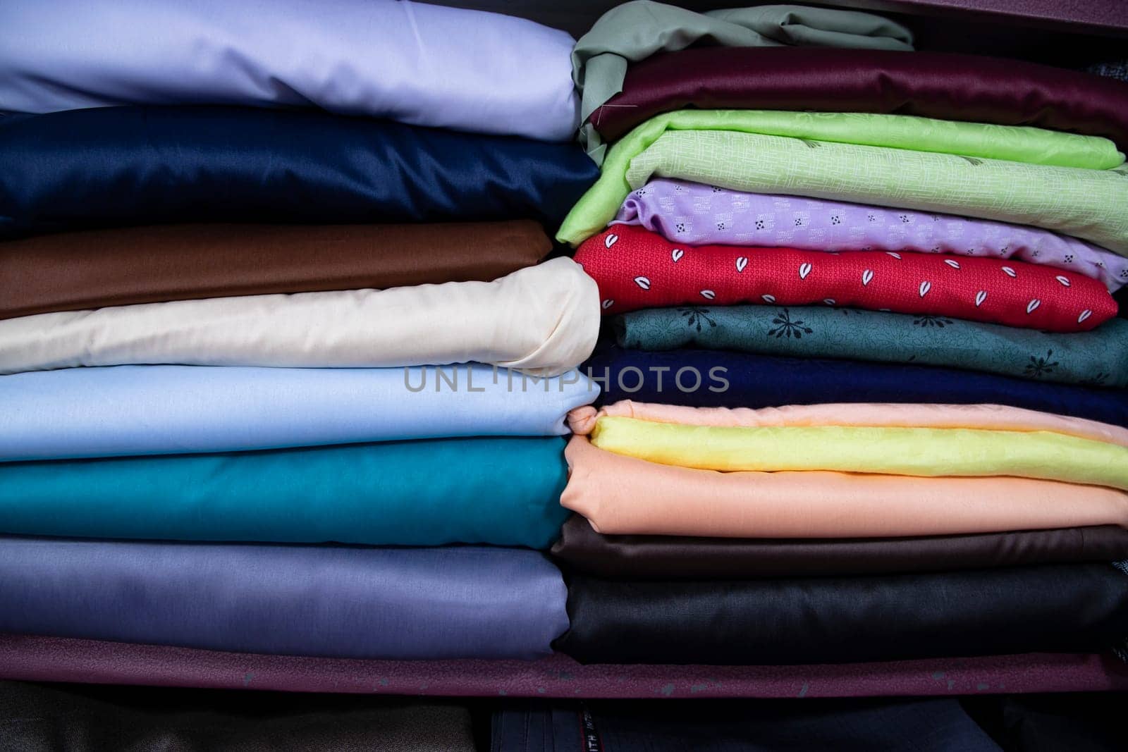 Patterned Textile Fabrics  stacked on a retail Shop Shelf for sale