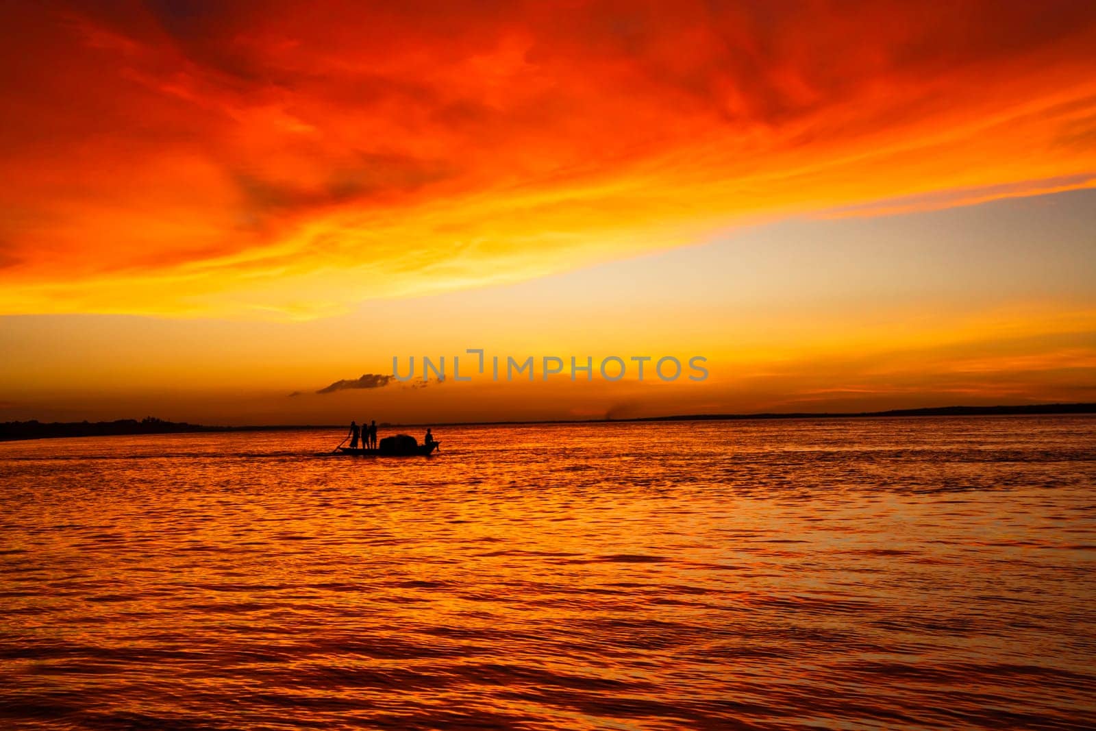 Beautiful  Scenic View Of Sea Against Orange Sky